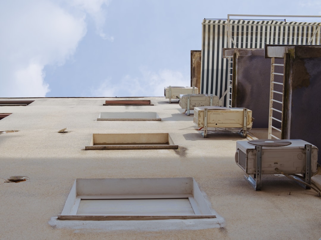 my-qualifications a-building-with-a-lot-of-windows-and-a-sky-background-vhclcseoyzm